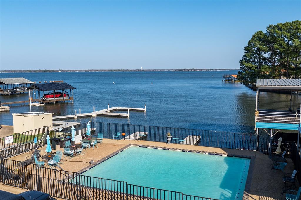 1933 Island Circle, Unit B209 Tool, TX 75143 - Photo 29 of 30 a terrace with outdoor seating and trees
