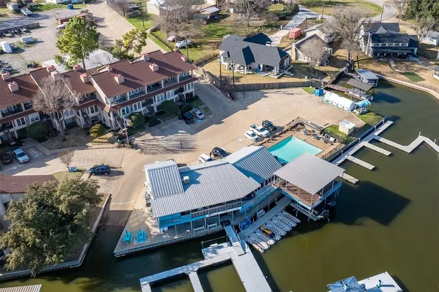 an aerial view of residential houses with outdoor space