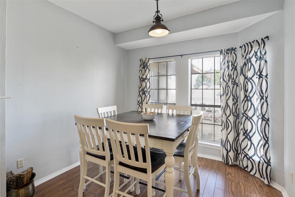 1933 Island Circle, Unit B209 Tool, TX 75143 - Photo 6 of 30 a view of a dining room with furniture and wooden floor