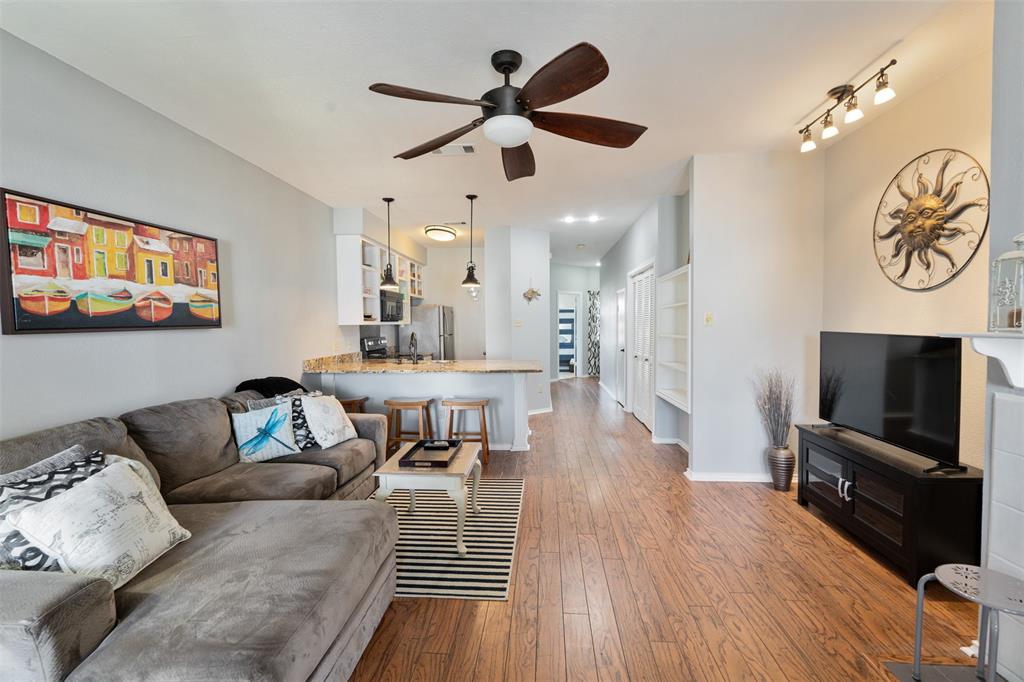 1933 Island Circle, Unit B209 Tool, TX 75143 - Photo 7 of 30 a living room with furniture and a flat screen tv