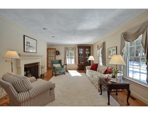 54 Pinecroft Road Weston, MA 02493 - Photo 5 of 30 a living room with furniture a fireplace and a large window