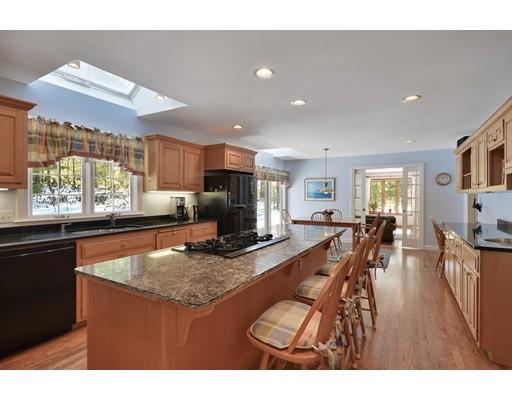 54 Pinecroft Road Weston, MA 02493 - Photo 6 of 30 a kitchen with stainless steel appliances granite countertop sink stove top oven and cabinets