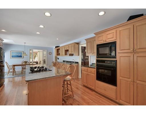 54 Pinecroft Road Weston, MA 02493 - Photo 7 of 30 a kitchen with stainless steel appliances granite countertop a refrigerator and a stove top oven
