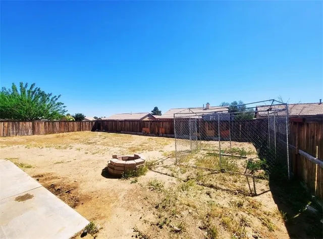 a view of a backyard of the house
