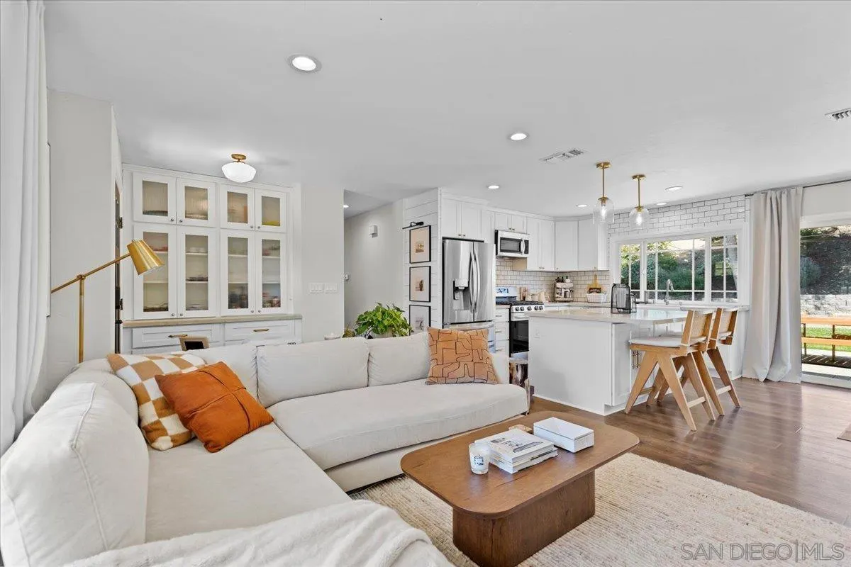 12243 Buckskin Trail Poway, CA 92064 - Photo 7 of 41 a living room with furniture and view of kitchen
