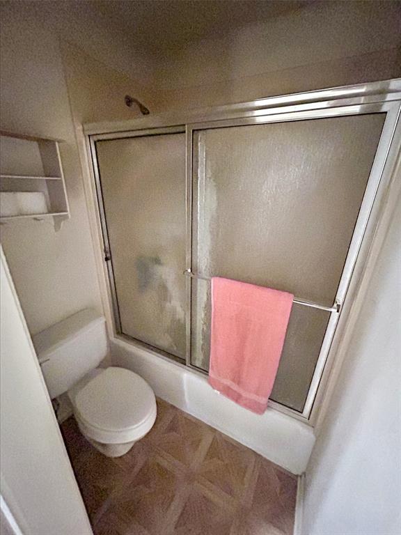 4905 Rippy Road Flower Mound, TX 75028 - Photo 13 of 29 Full bathroom featuring toilet and combined bath / shower with glass door