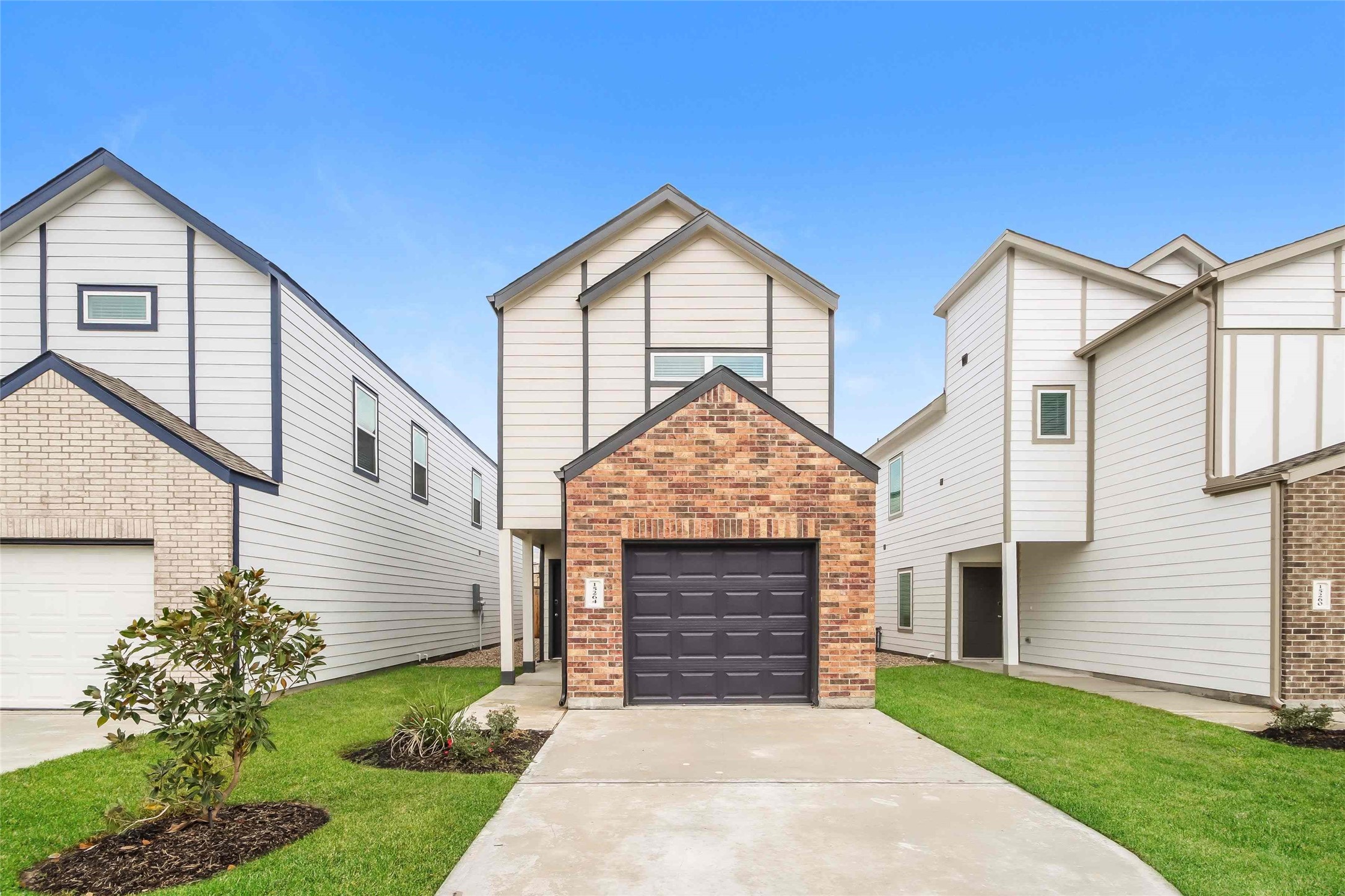15264 Estrella Road East Houston, TX 77073 - Photo 1 of 14 a front view of a house with a yard and garage