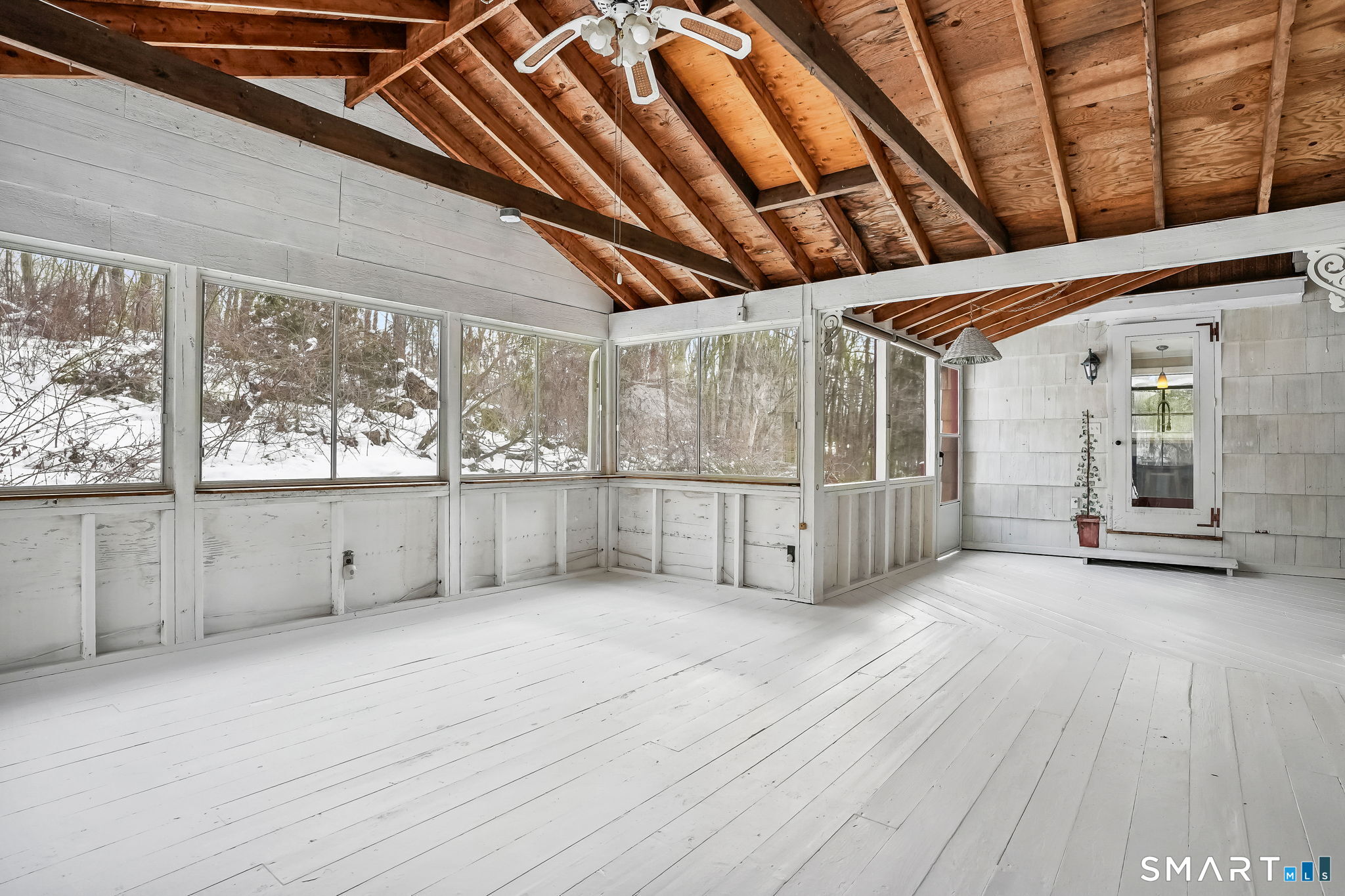 12 Skidmore Lane Sandy Hook, CT 06482 - Photo 16 of 27 a view of an empty room with wooden floor and a window