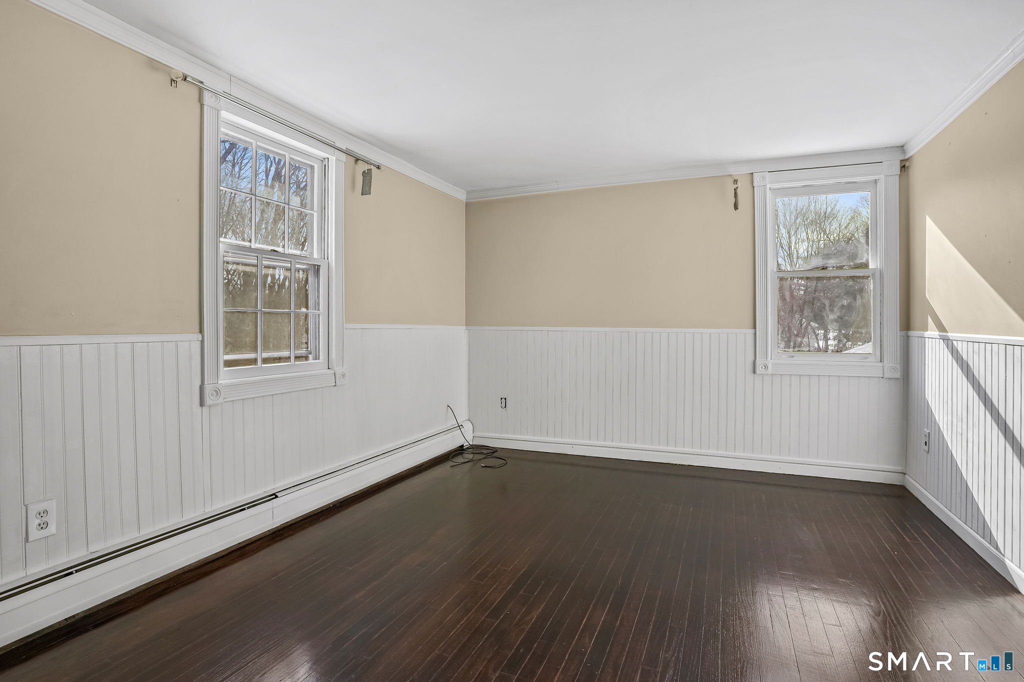 12 Skidmore Lane Sandy Hook, CT 06482 - Photo 17 of 27 a view of an empty room with wooden floor and a window