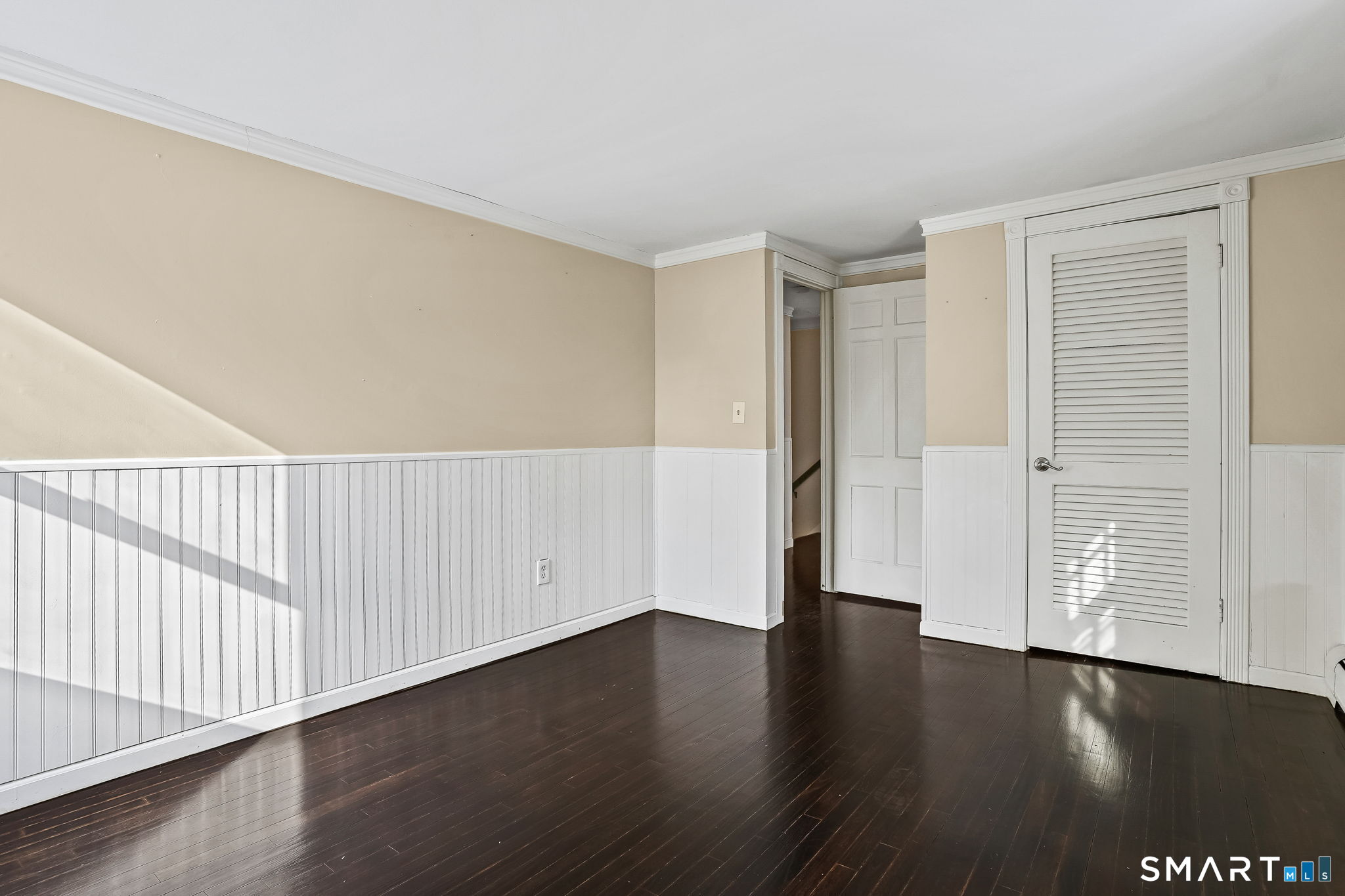 12 Skidmore Lane Sandy Hook, CT 06482 - Photo 18 of 27 a view of an empty room with wooden floor
