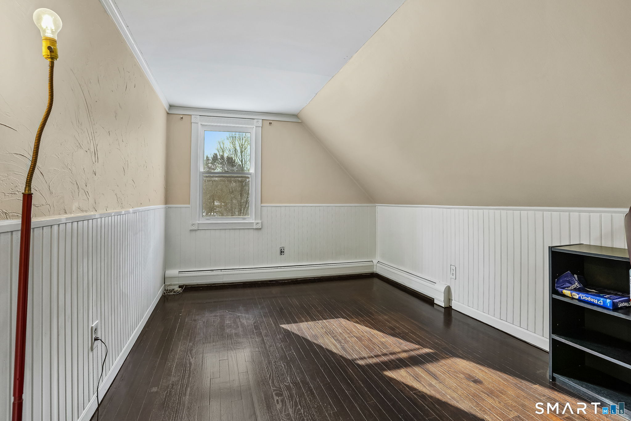 12 Skidmore Lane Sandy Hook, CT 06482 - Photo 19 of 27 a view of empty room with wooden floor and fan