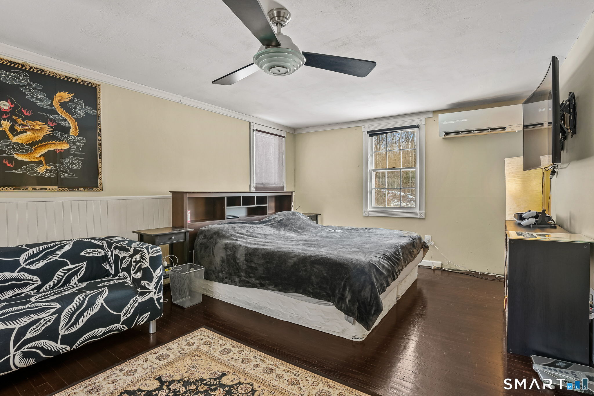 12 Skidmore Lane Sandy Hook, CT 06482 - Photo 22 of 27 a bedroom with a bed and wooden floor