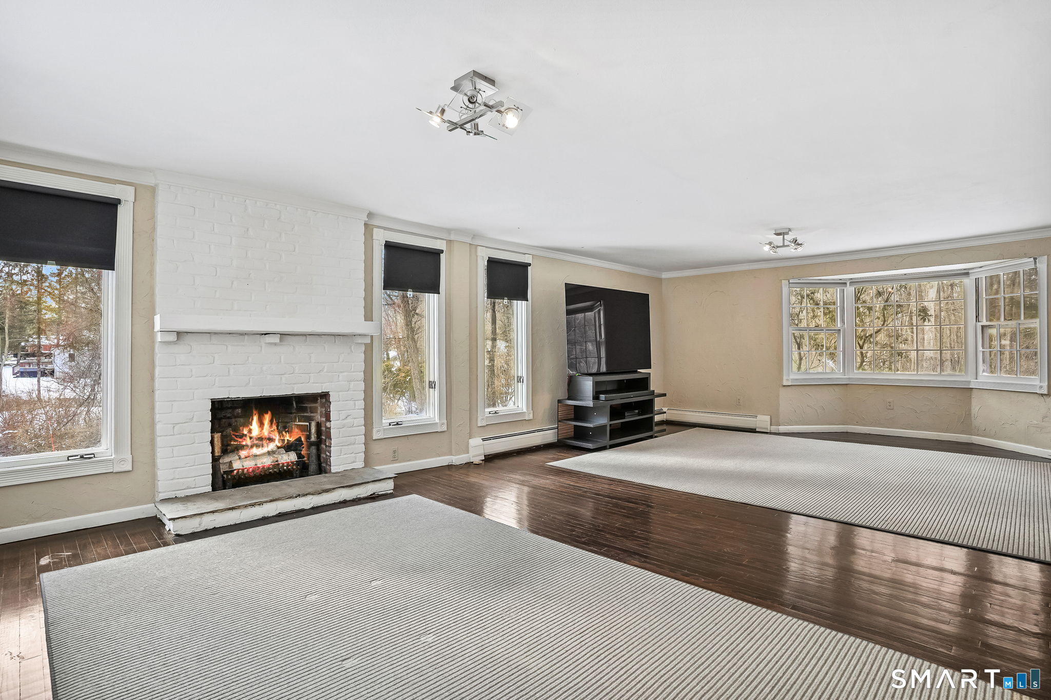 12 Skidmore Lane Sandy Hook, CT 06482 - Photo 5 of 27 a living room with furniture and a fireplace
