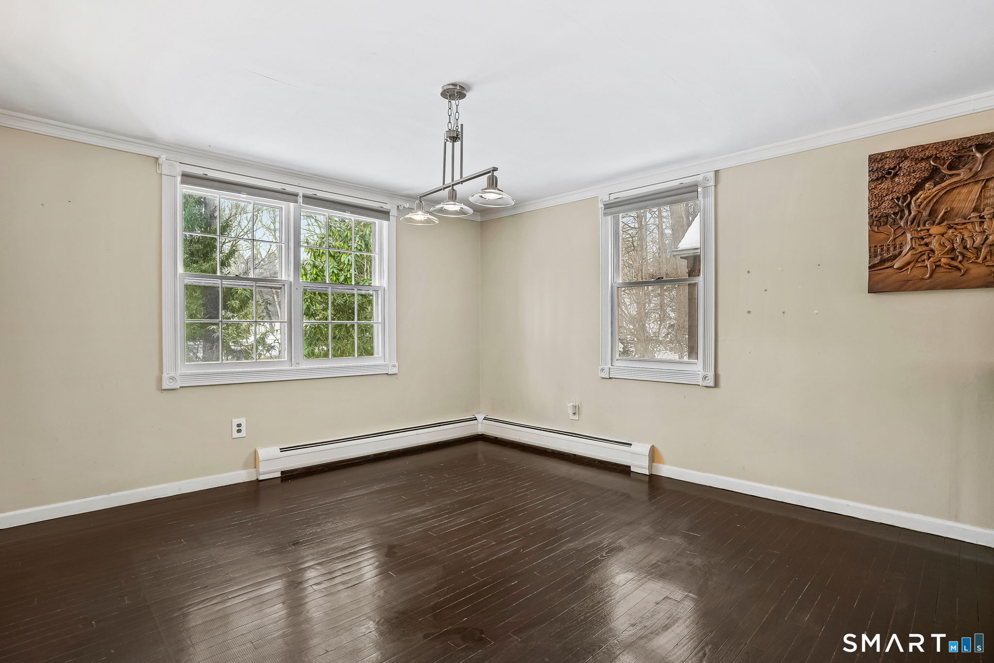 12 Skidmore Lane Sandy Hook, CT 06482 - Photo 7 of 27 a view of an empty room with wooden floor and a window