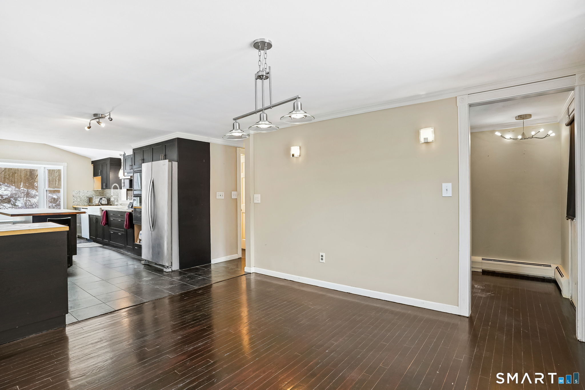 12 Skidmore Lane Sandy Hook, CT 06482 - Photo 9 of 27 a view of a kitchen with refrigerator and wooden floor