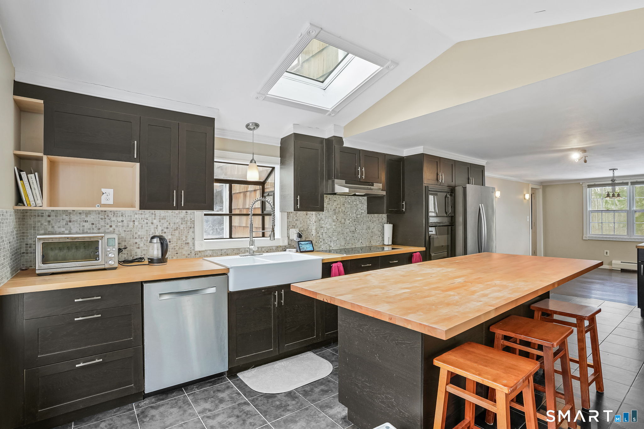 12 Skidmore Lane Sandy Hook, CT 06482 - Photo 10 of 27 a kitchen with a sink a stove a refrigerator and cabinets