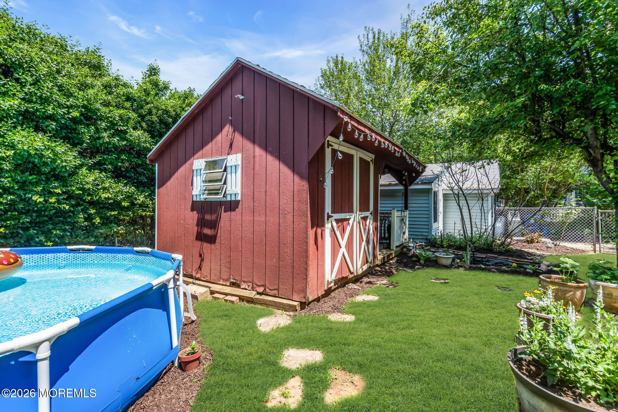 24 Foster Street Middletown, NJ 07701 - Photo 16 of 23 a view of backyard with deck and garden
