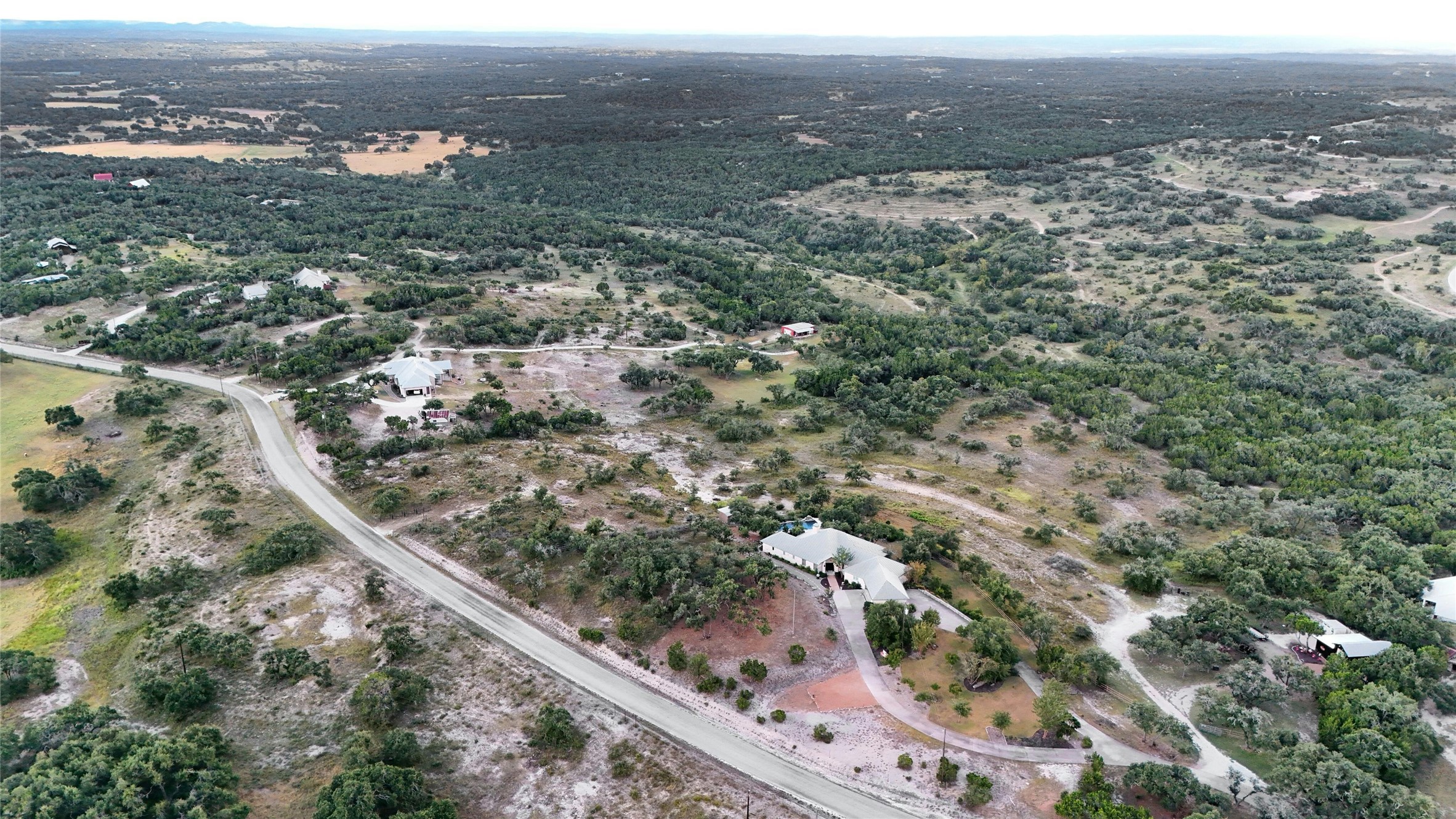 8019 Mt Sharp Road Wimberley, TX 78676 - Photo 8 of 14 an aerial view of residential houses with outdoor space and trees