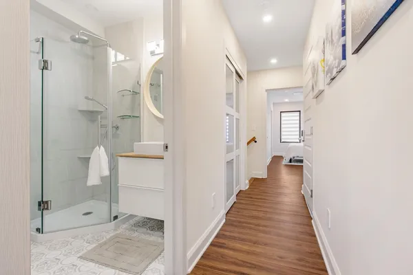 a view of a bathroom with tub and shower