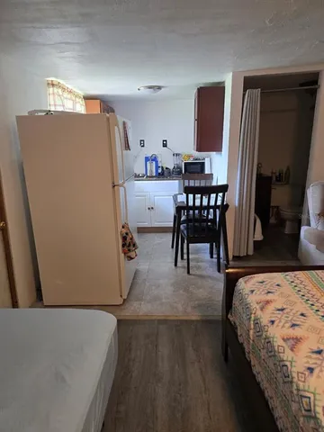 a bedroom with a bed and a table in it