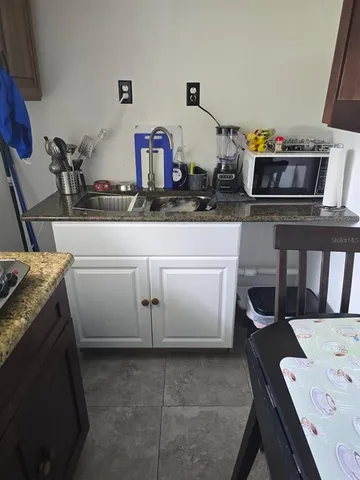a kitchen with a sink and cabinets