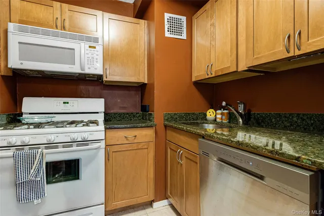 a kitchen with a stove and a refrigerator