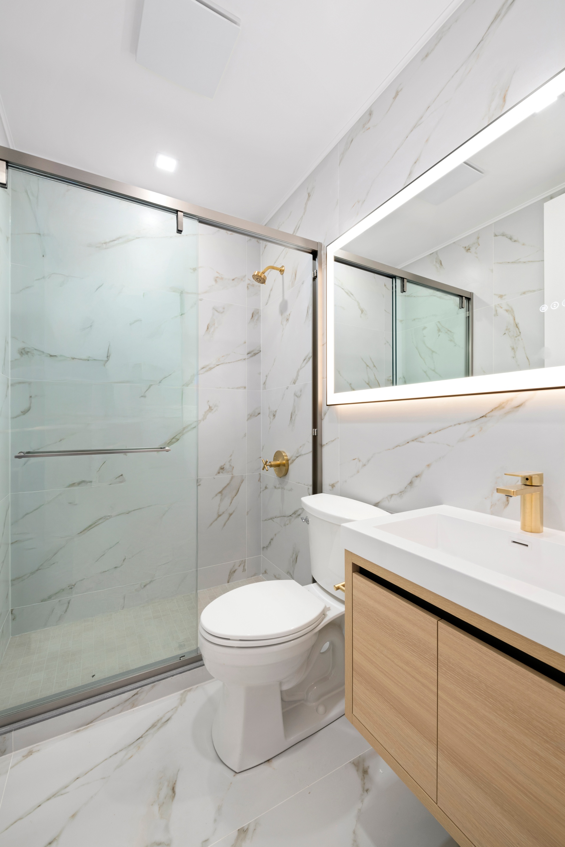 78 Harman Street, Unit 4F Brooklyn, NY 11221 - Photo 5 of 9 a bathroom with a sink a toilet and shower