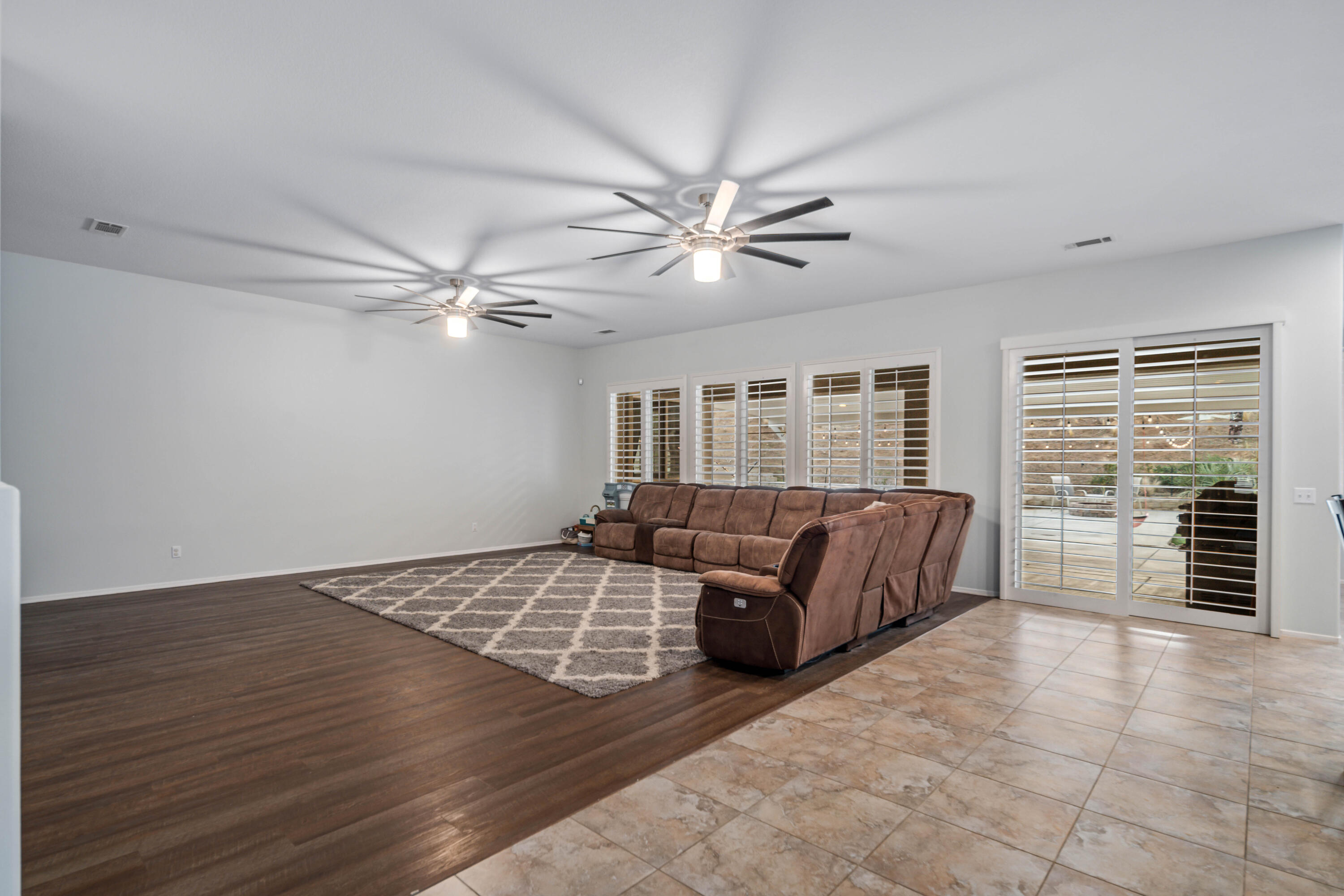 40467 Tiger Way Palmdale, CA 93551 - Photo 16 of 60 a living room with furniture and a flat screen tv