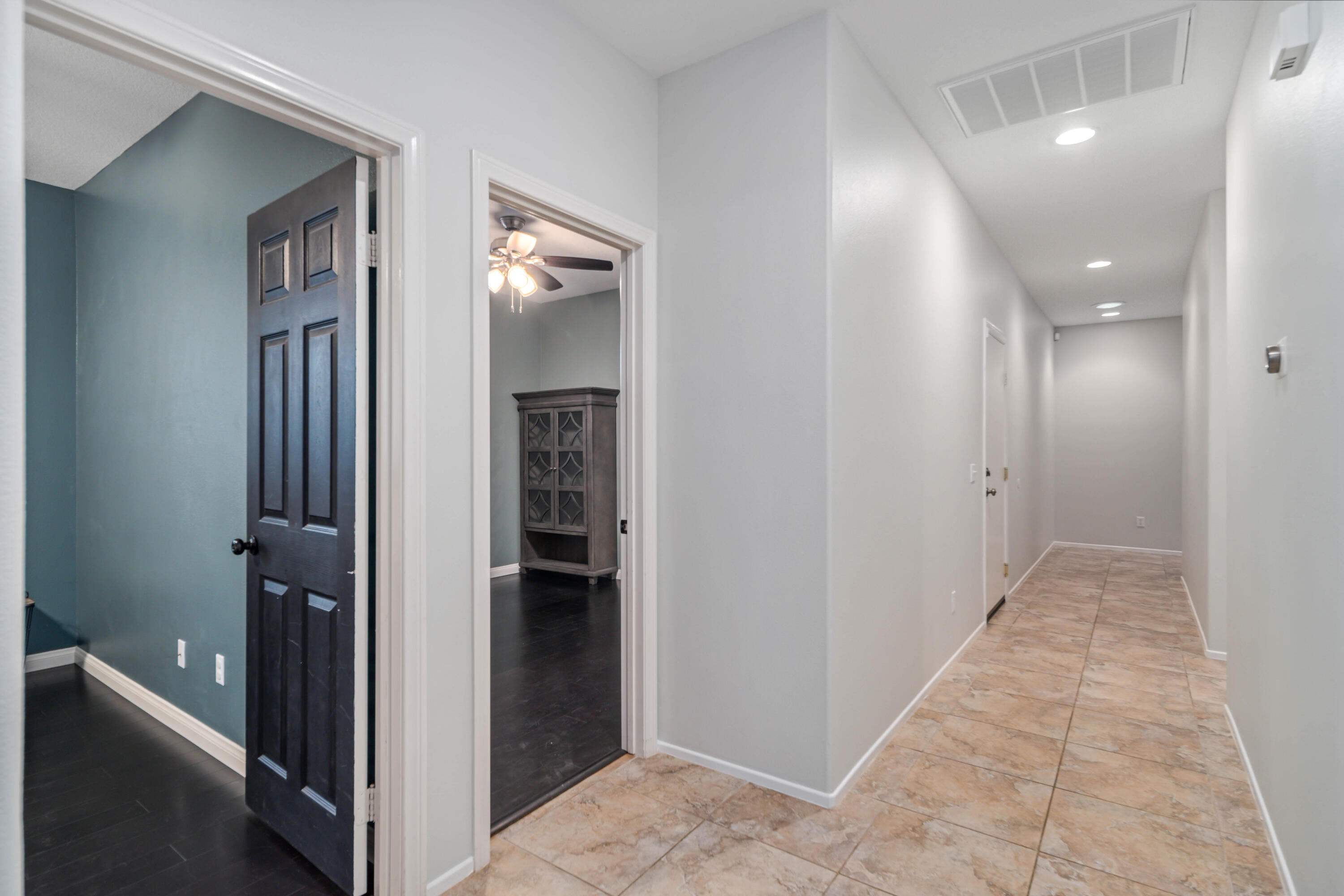 40467 Tiger Way Palmdale, CA 93551 - Photo 19 of 60 a view of a hallway with closet and a bathroom