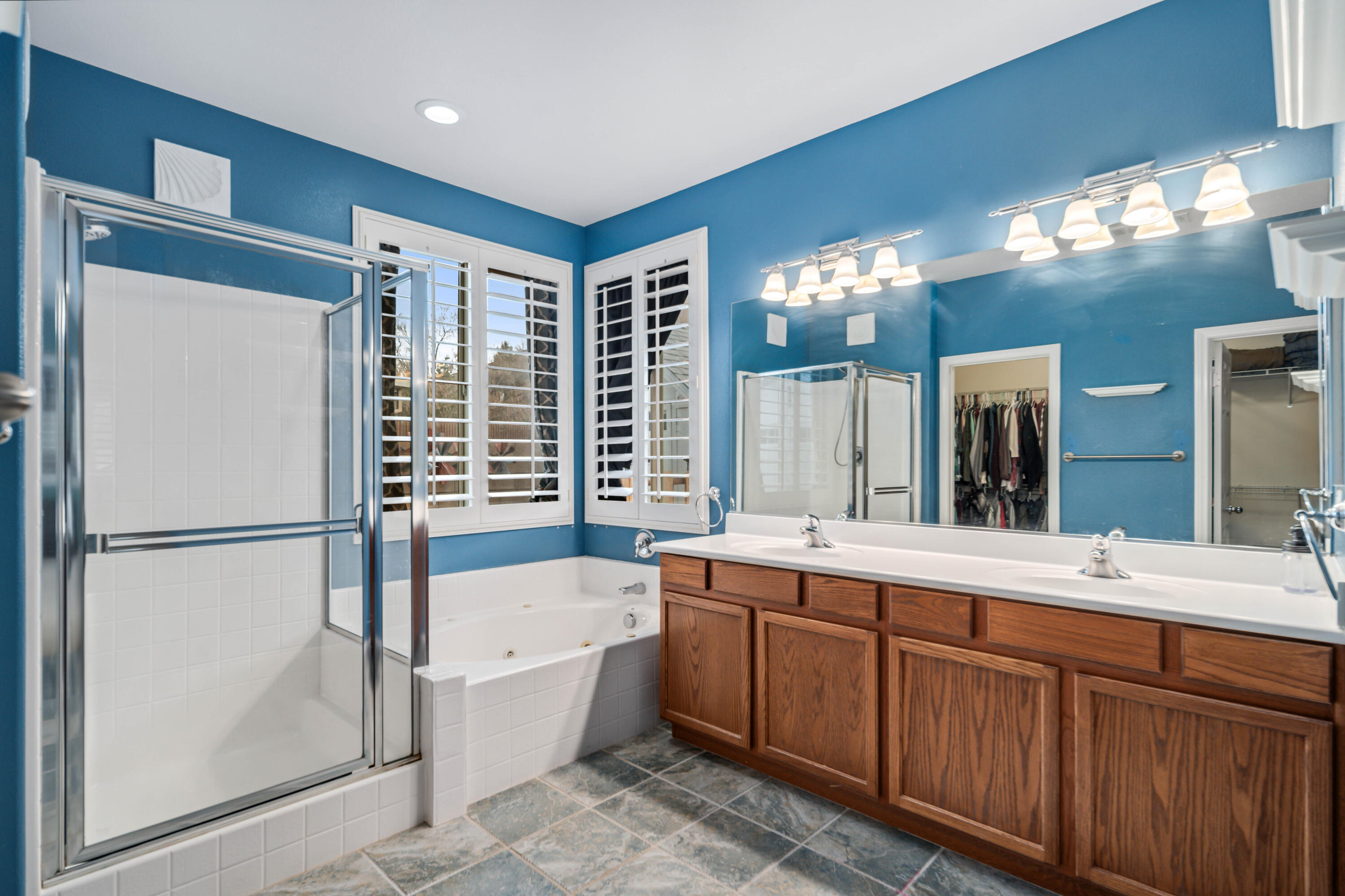 40467 Tiger Way Palmdale, CA 93551 - Photo 24 of 60 a bathroom with a tub sink and mirror