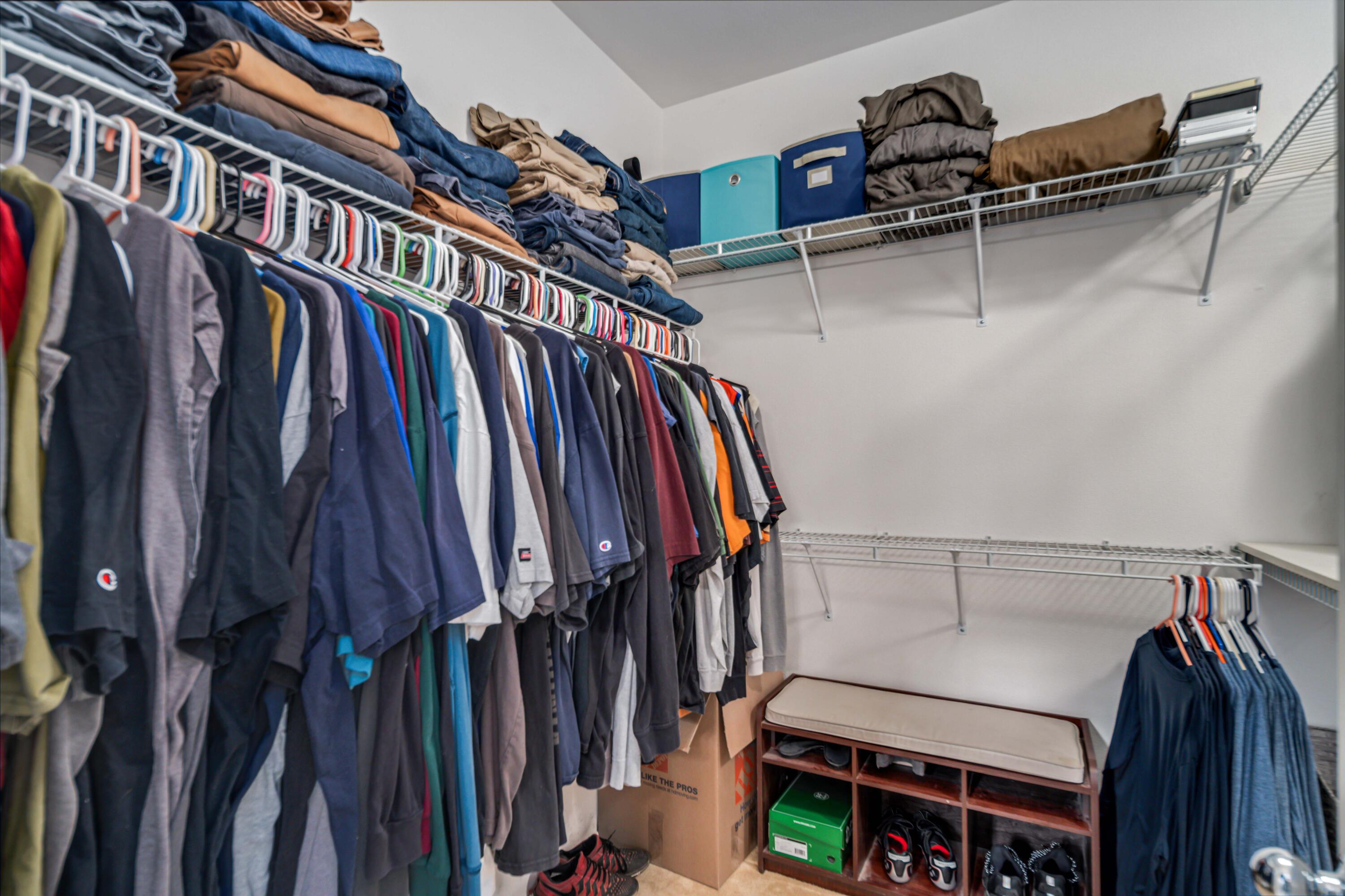 40467 Tiger Way Palmdale, CA 93551 - Photo 26 of 60 a view of walk in closet with clothes and shoes