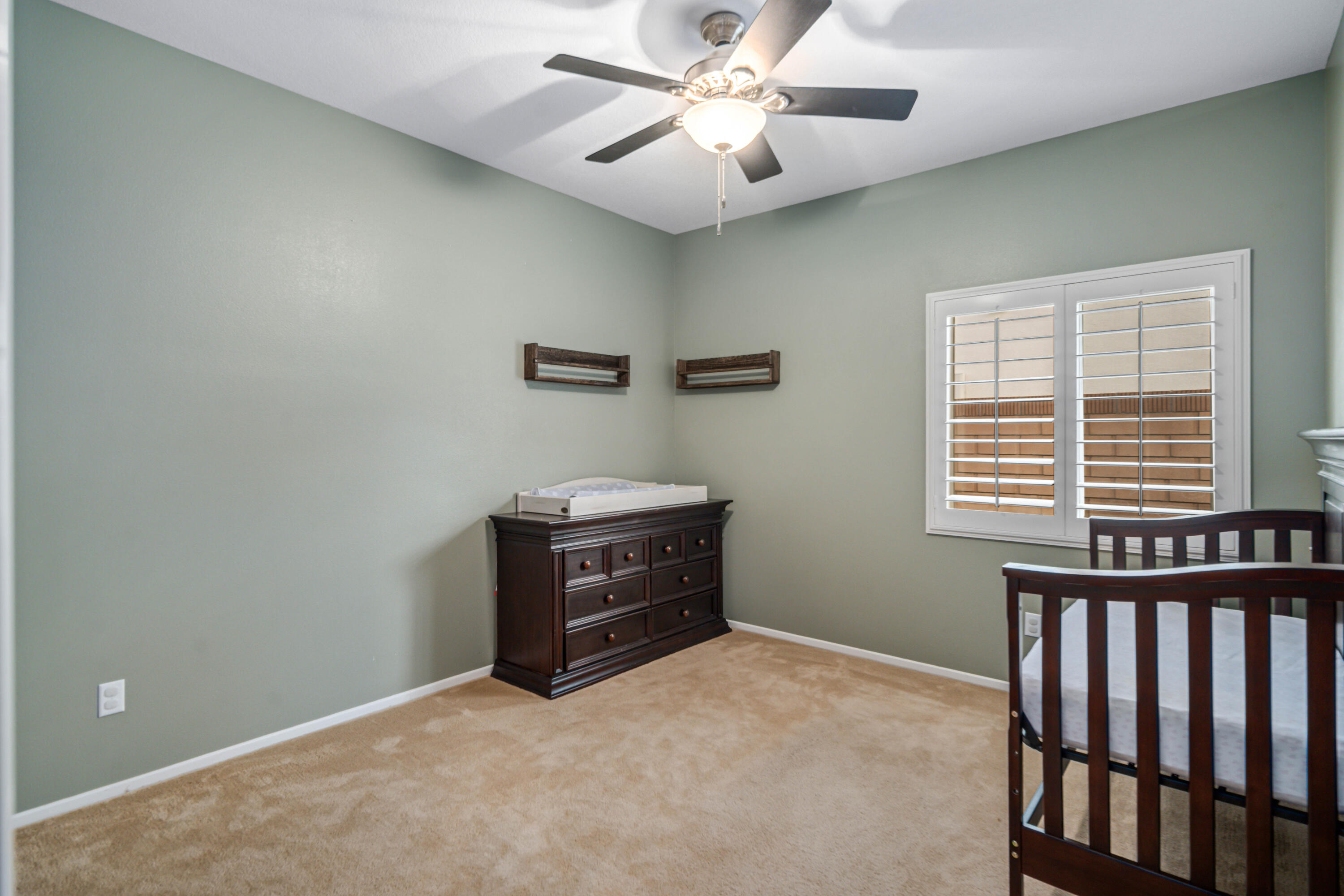 40467 Tiger Way Palmdale, CA 93551 - Photo 27 of 60 a view of an empty room with a window and a ceiling fan