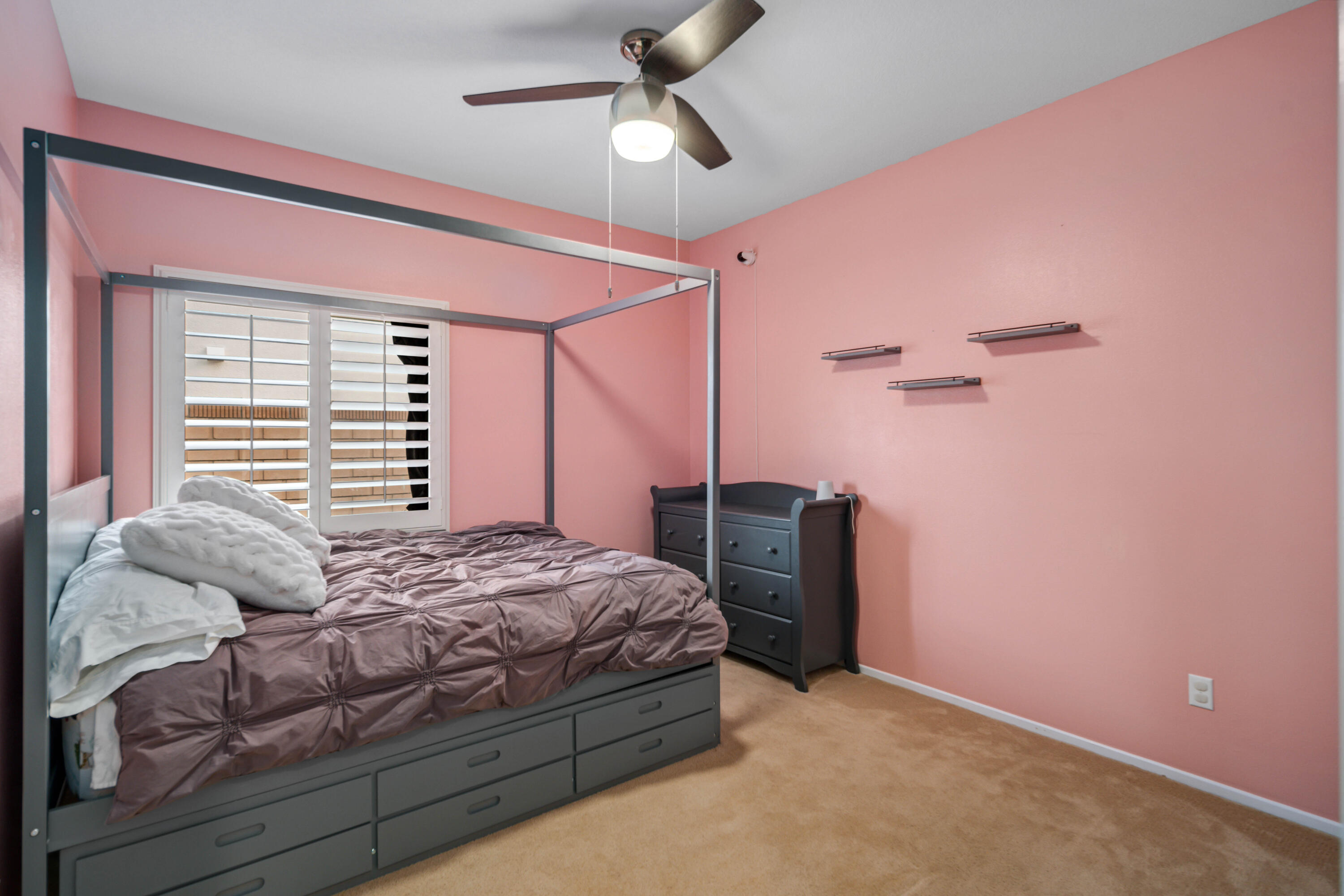 40467 Tiger Way Palmdale, CA 93551 - Photo 28 of 60 a bedroom with a bed and a ceiling fan