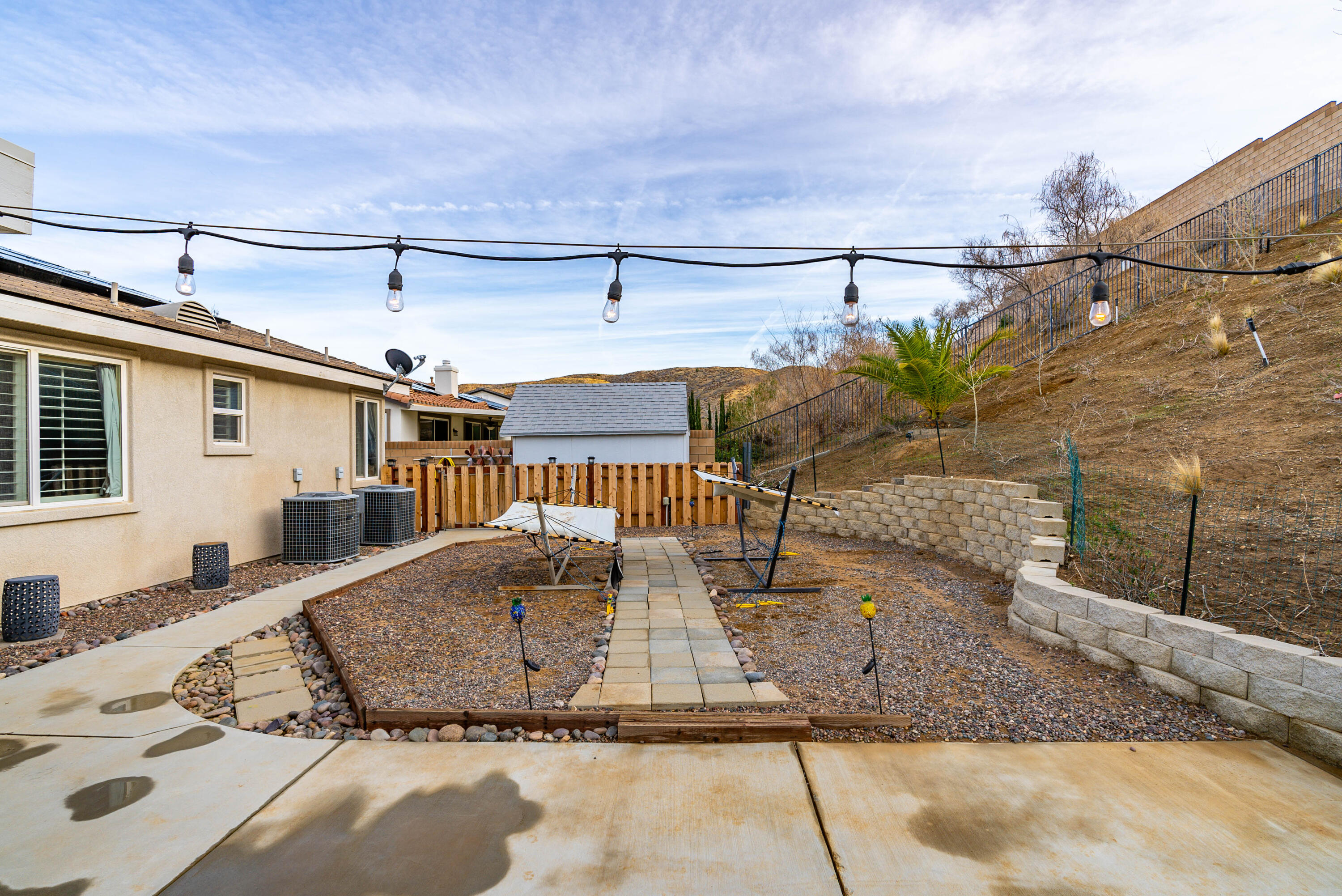 40467 Tiger Way Palmdale, CA 93551 - Photo 42 of 60 a view of a house with a patio
