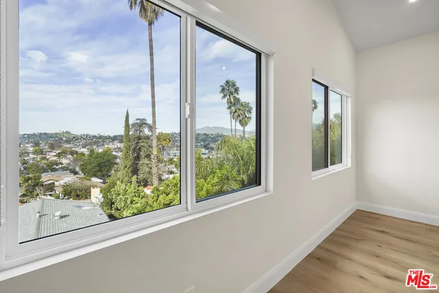 a spacious bathroom with a shower a sink and a toilet