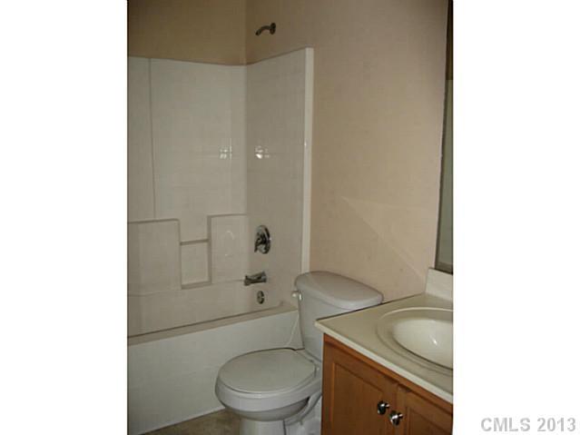 5727 Charing Place Charlotte, NC 28211 - Photo 12 of 15 a bathroom with a toilet a sink and shower