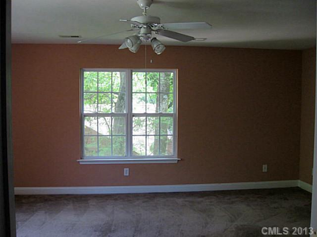 5727 Charing Place Charlotte, NC 28211 - Photo 14 of 15 an empty room with a window