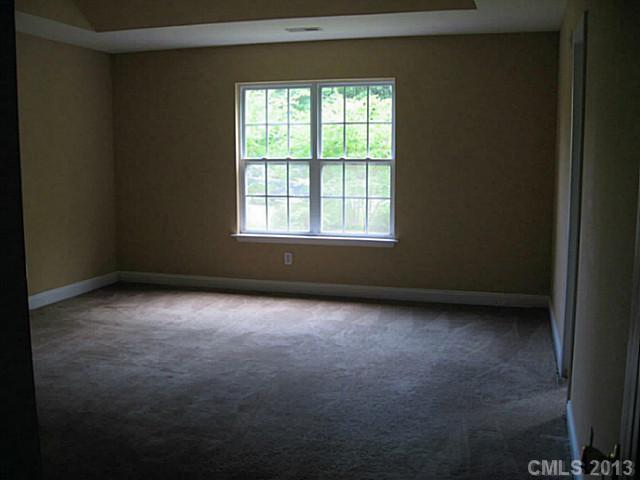 5727 Charing Place Charlotte, NC 28211 - Photo 9 of 15 an empty room with a window