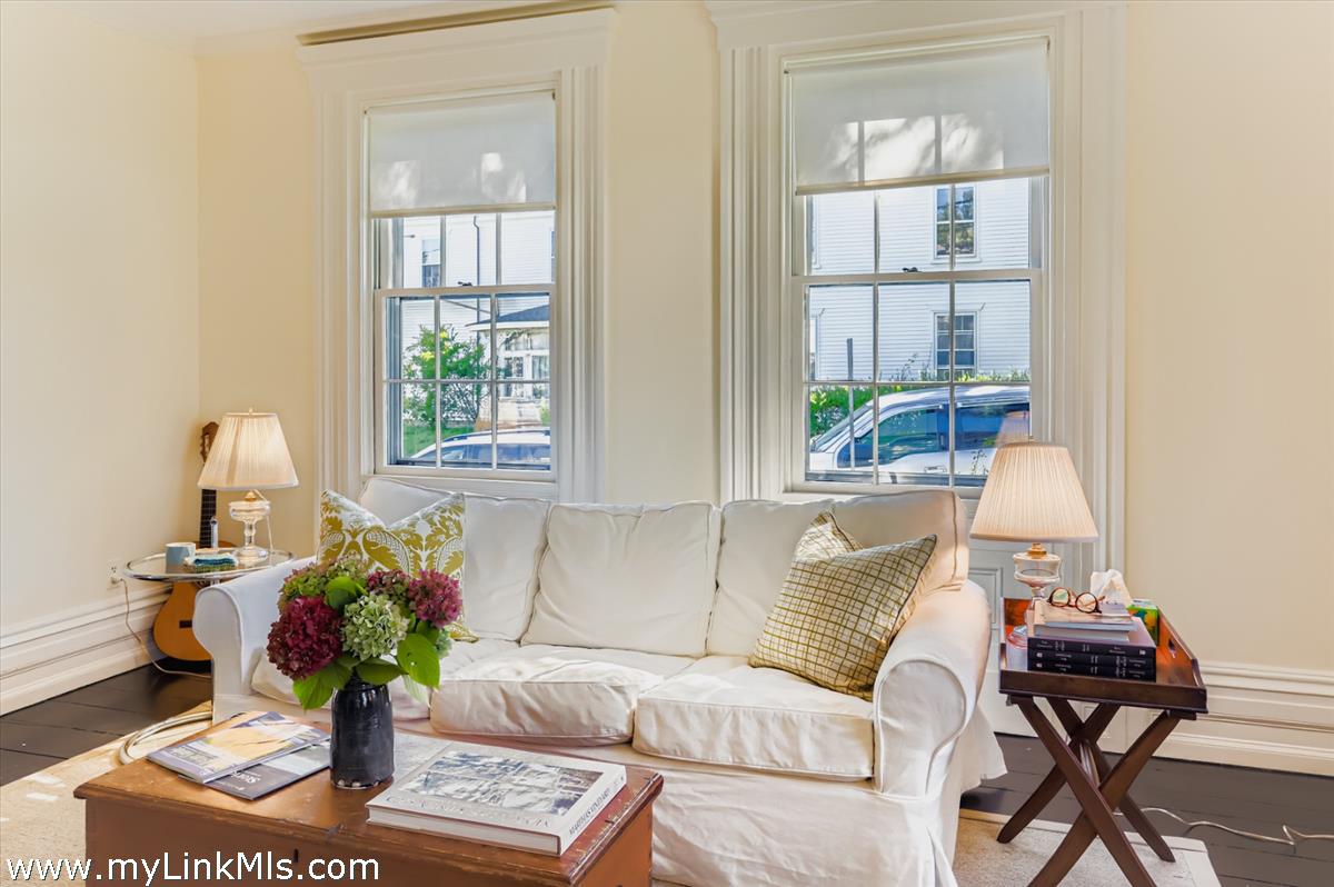 27 Spring Street Vineyard Haven, MA 02568 - Photo 20 of 58 a living room with furniture and a potted plant