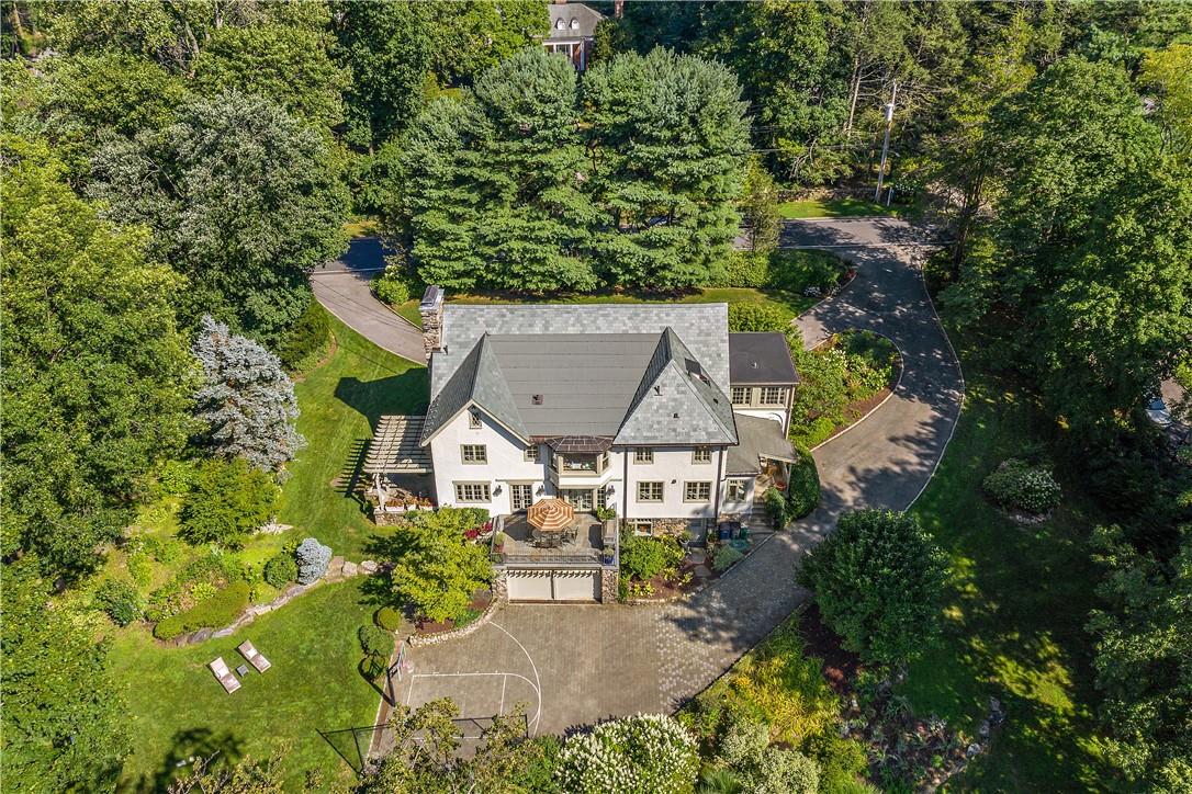 1.61 Blissful Rustic Acres.  Lush Mature Evergreens Surround The Property. Several Picturesque Terraces and Fun Kid's Basketball Court Can Be Seen in This Aerial Photo