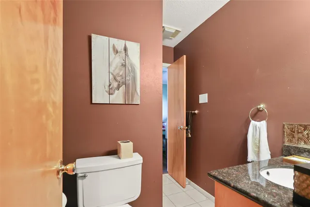 a kitchen with counter top space and wooden floor