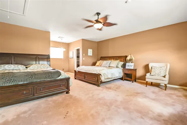 a bedroom with bed and window