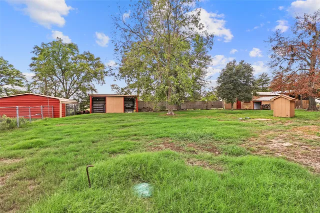 a view of a room with a fan and a window