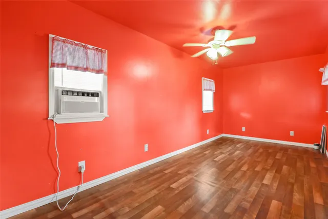 a view of a house with backyard and a tree
