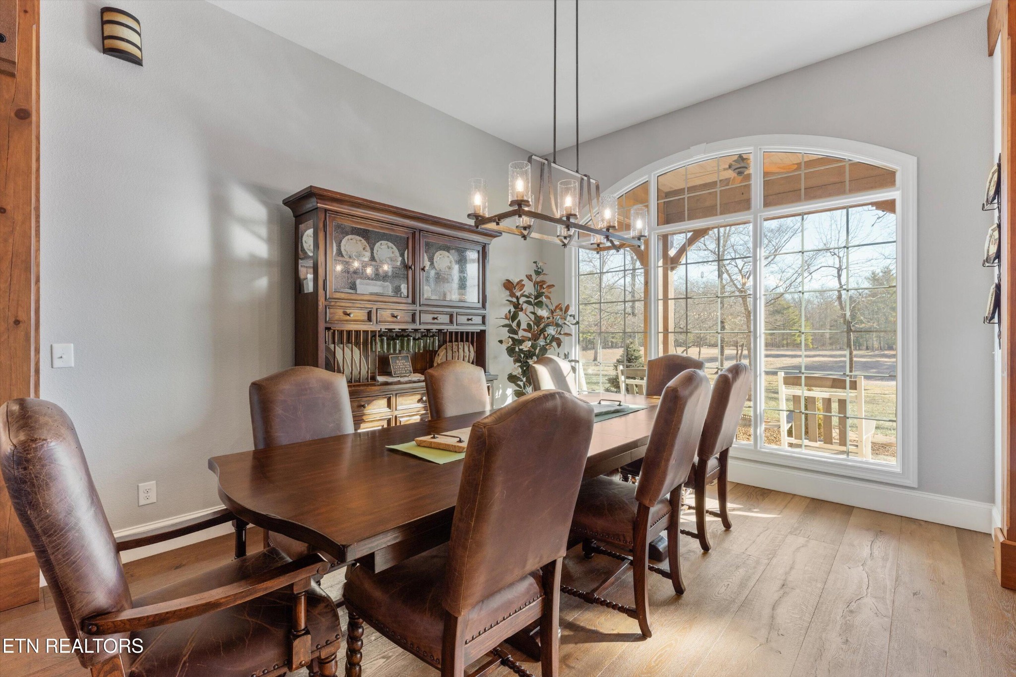1752 Hillendale Road Crossville, TN 38572 - Photo 15 of 60 a view of a dining room with furniture window and wooden floor