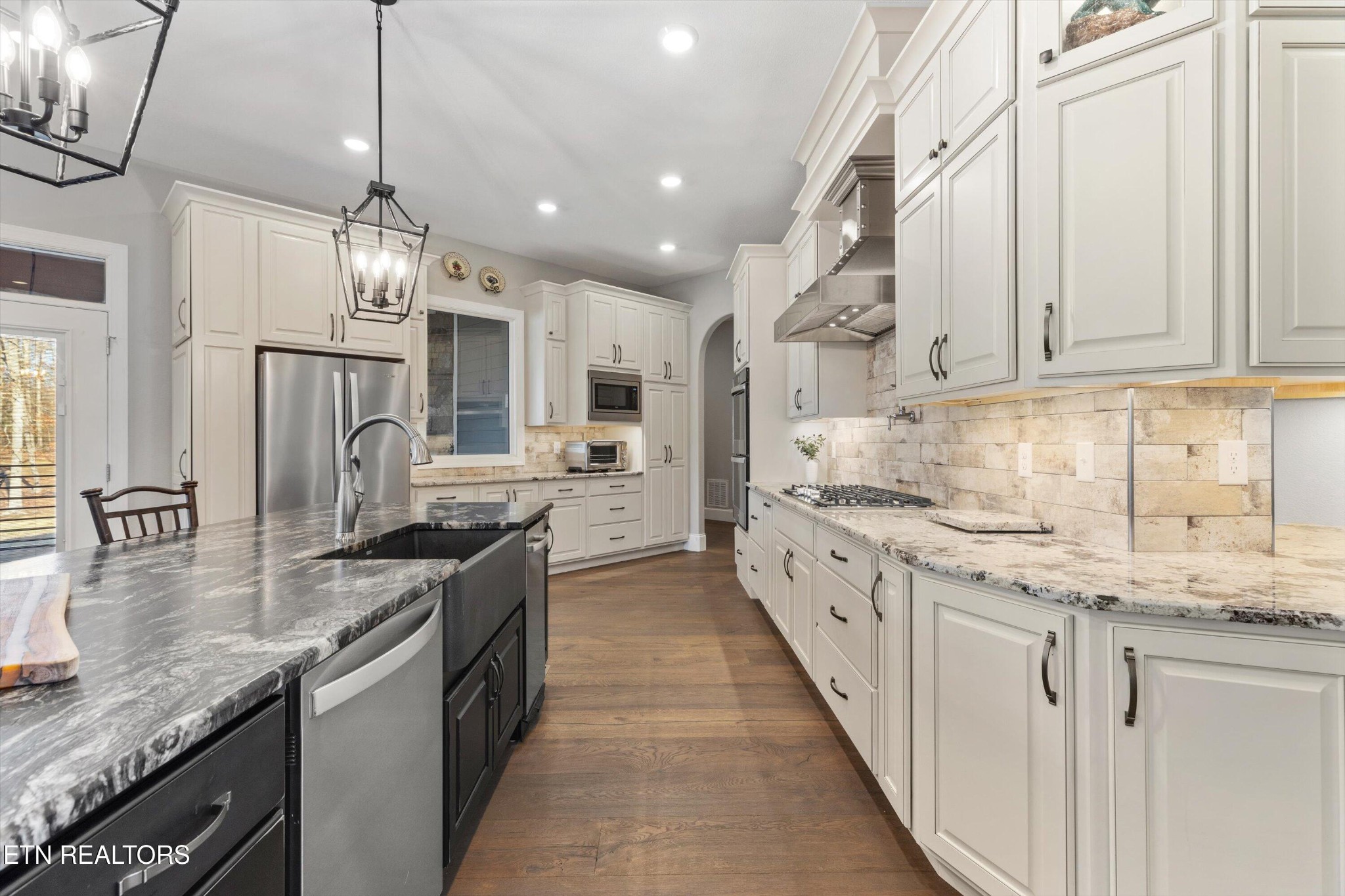 1752 Hillendale Road Crossville, TN 38572 - Photo 19 of 60 a kitchen with stainless steel appliances granite countertop a sink and stove