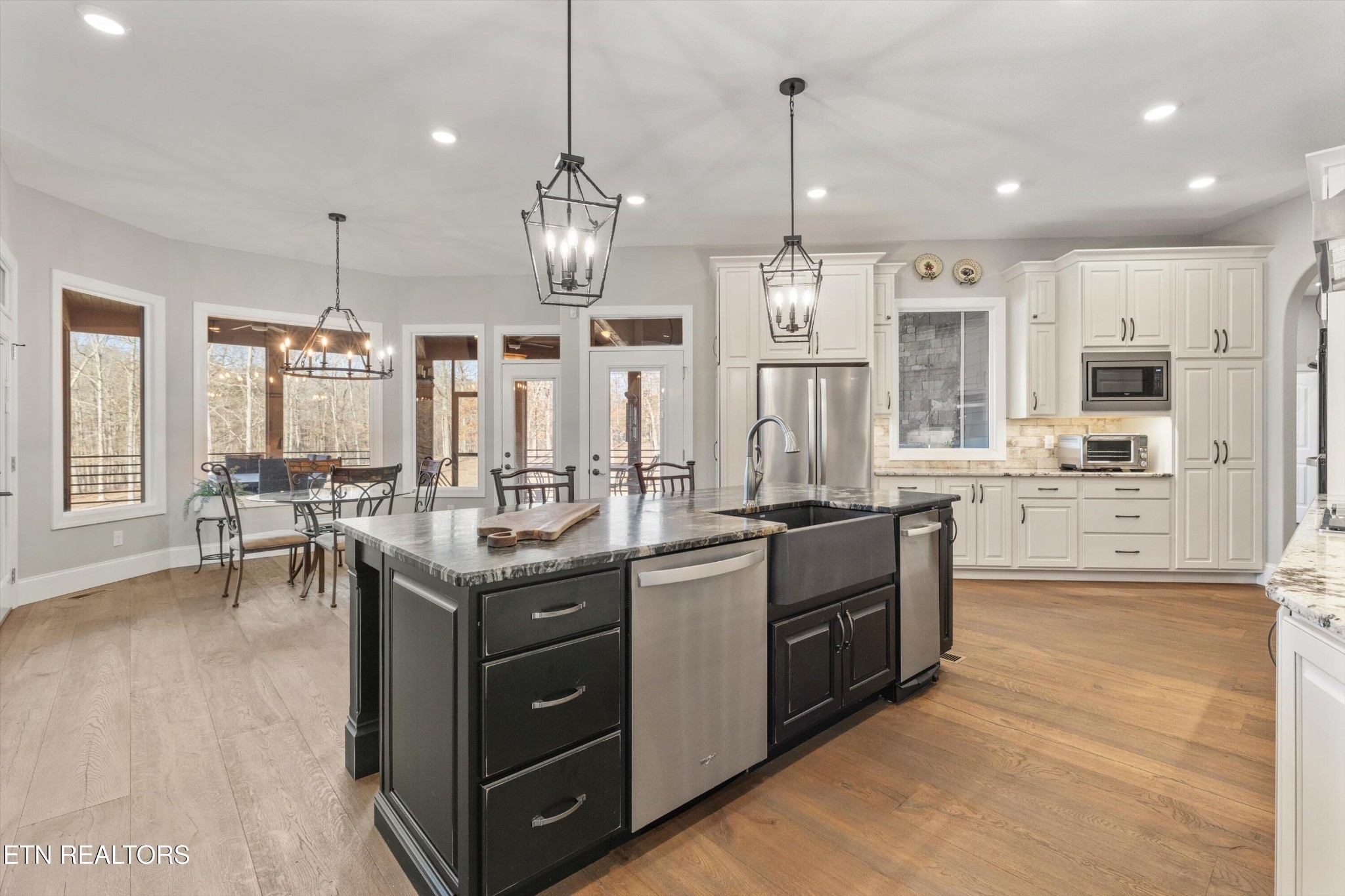 1752 Hillendale Road Crossville, TN 38572 - Photo 20 of 60 a kitchen with stainless steel appliances granite countertop a sink a stove and a wooden floors