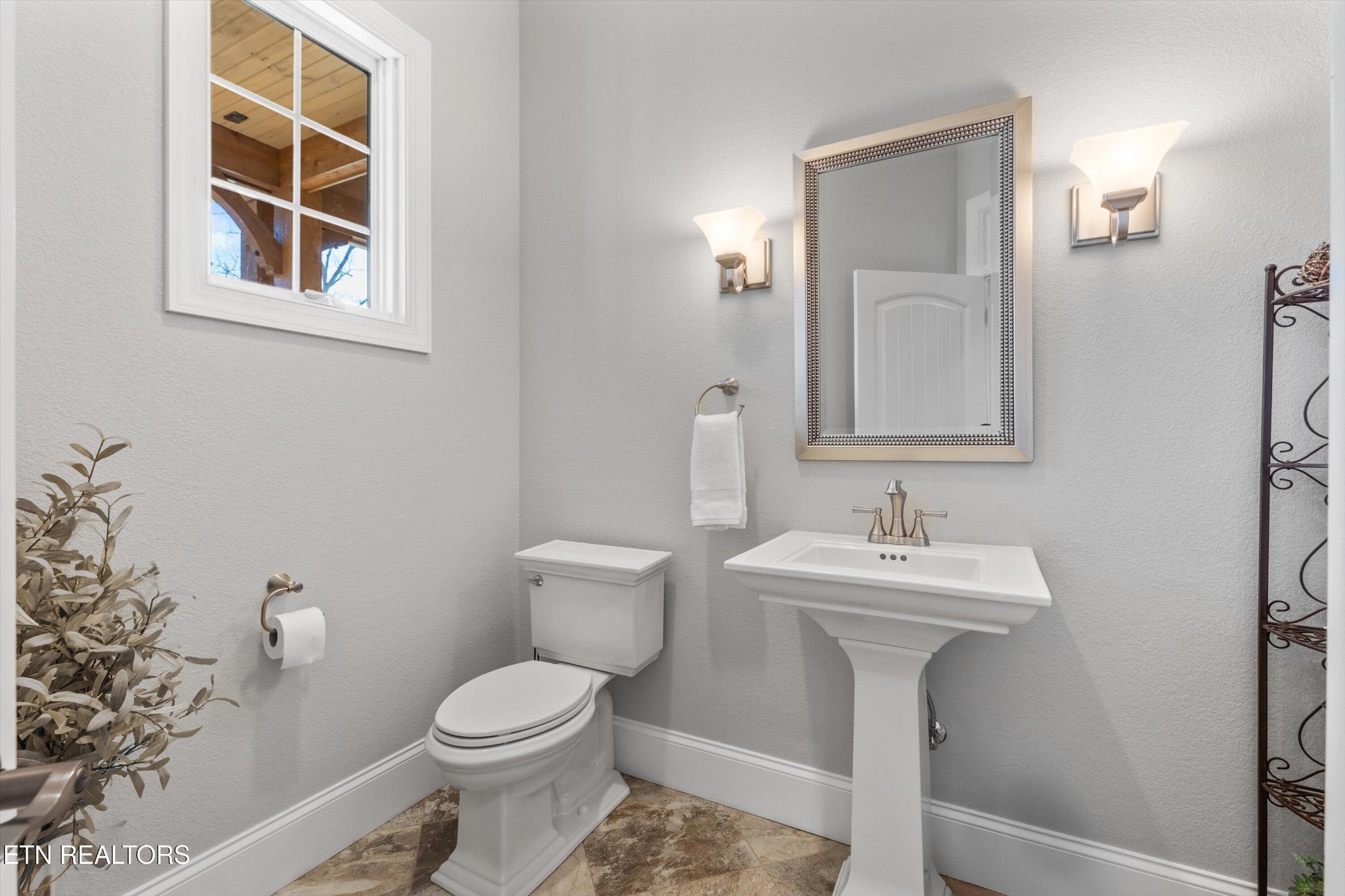 1752 Hillendale Road Crossville, TN 38572 - Photo 25 of 60 a bathroom with a toilet sink and mirror
