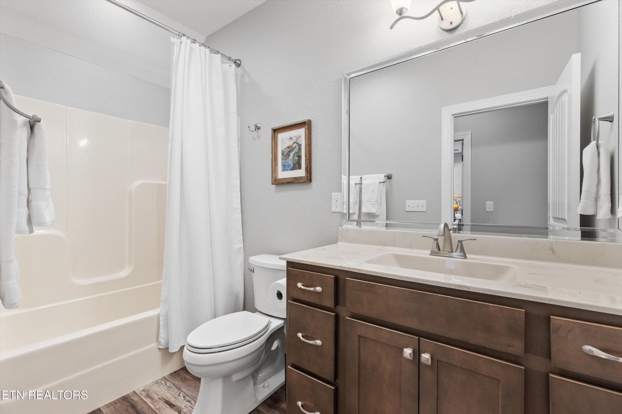 1752 Hillendale Road Crossville, TN 38572 - Photo 36 of 60 a bathroom with a sink toilet vanity and shower