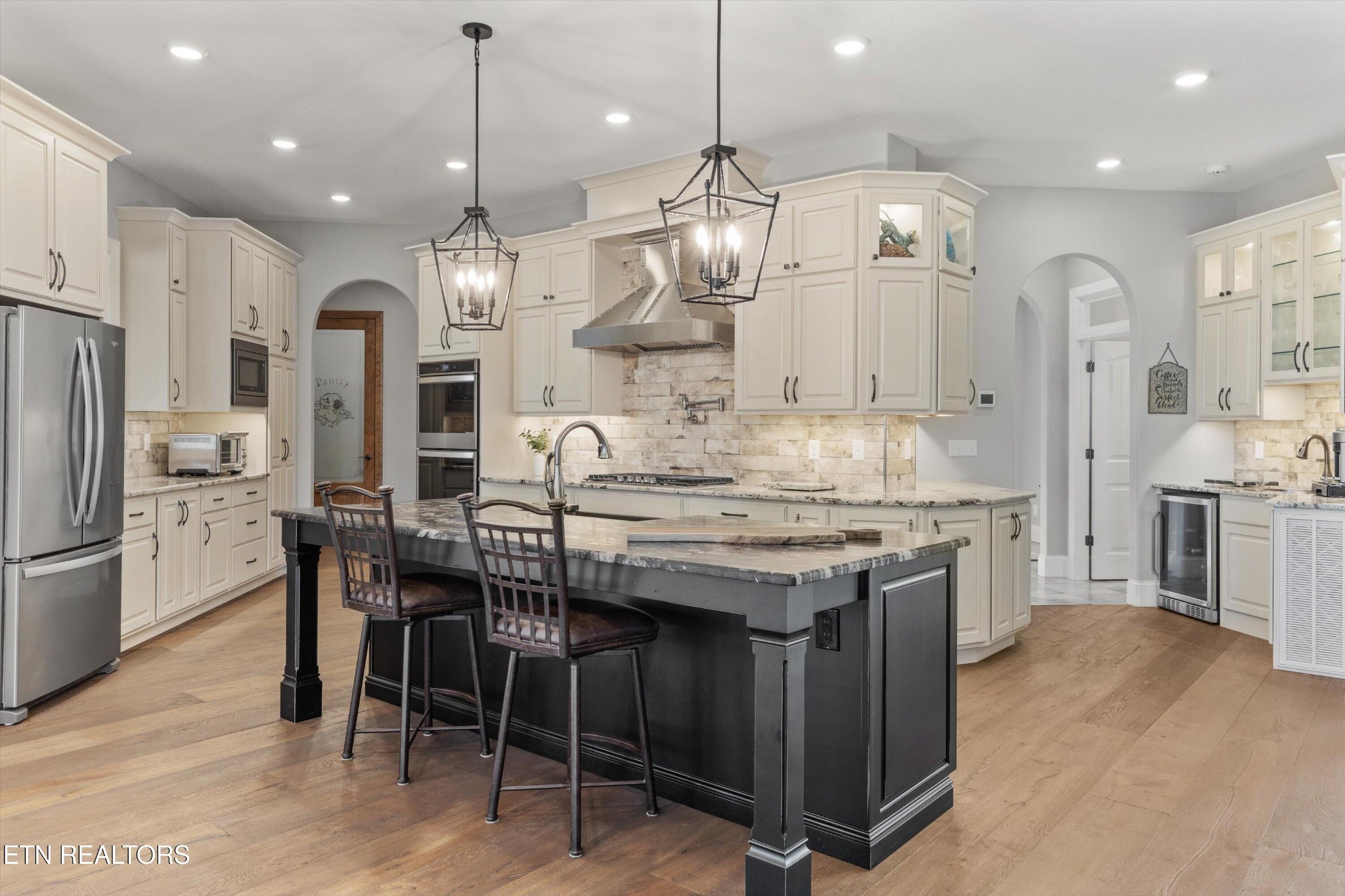 1752 Hillendale Road Crossville, TN 38572 - Photo 4 of 60 a kitchen with granite countertop a table chairs stainless steel appliances and cabinets